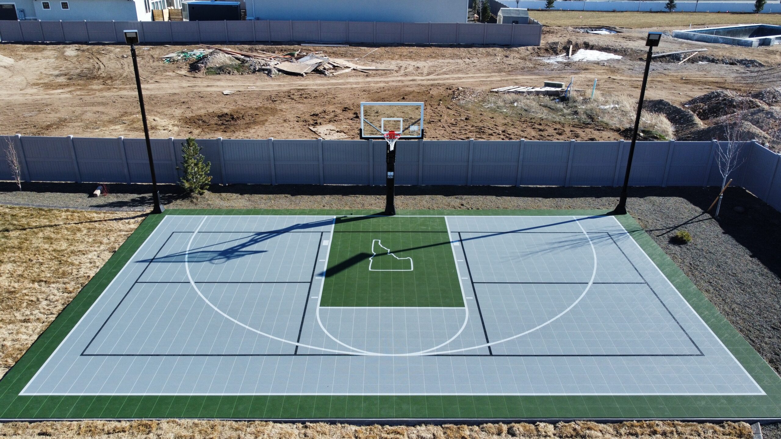 Gray And Green Game Court Idaho Logo